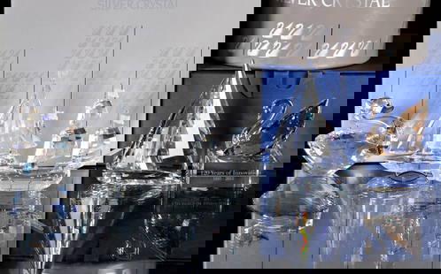 FIVE SWAROVSKI CRYSTAL FIGURES WITH BOXES: 1) Santa Maria, 000003, measures 3.5 inches. 2) Sailboat, 000004, measures 3.75 inches. 3) Sailing Legend, 000006, measures 4.125 inches. 4) Swan Event Piece 2015, 5137830, measures 3.125 inches.