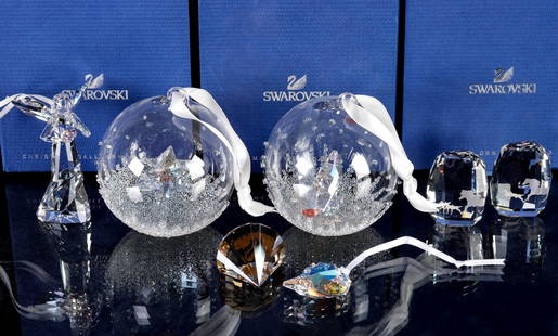 SEVEN SWAROVSKI CRYSTAL ORNAMENTS WITH BOXES: 1) Christmas Ball ornament 2014, 5059023, measures 3.5 inches. 2) Christmas Ball ornament 2013, 5004498, measures 3.5 inches. 3) Angel ornament 2013, 5004493, measures 3.25 inches. 4) Feather ornament