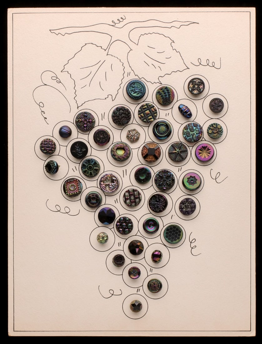 COLLECTION OF CZECH IRIDIZED GLASS SEWING BUTTONS: The carded collection of elaborate molded glass buttons with bright finish is offered as shown. Sizes range from 0.5 to 0.75 inches. Without proof of exemption, be aware that internet sales tax applie