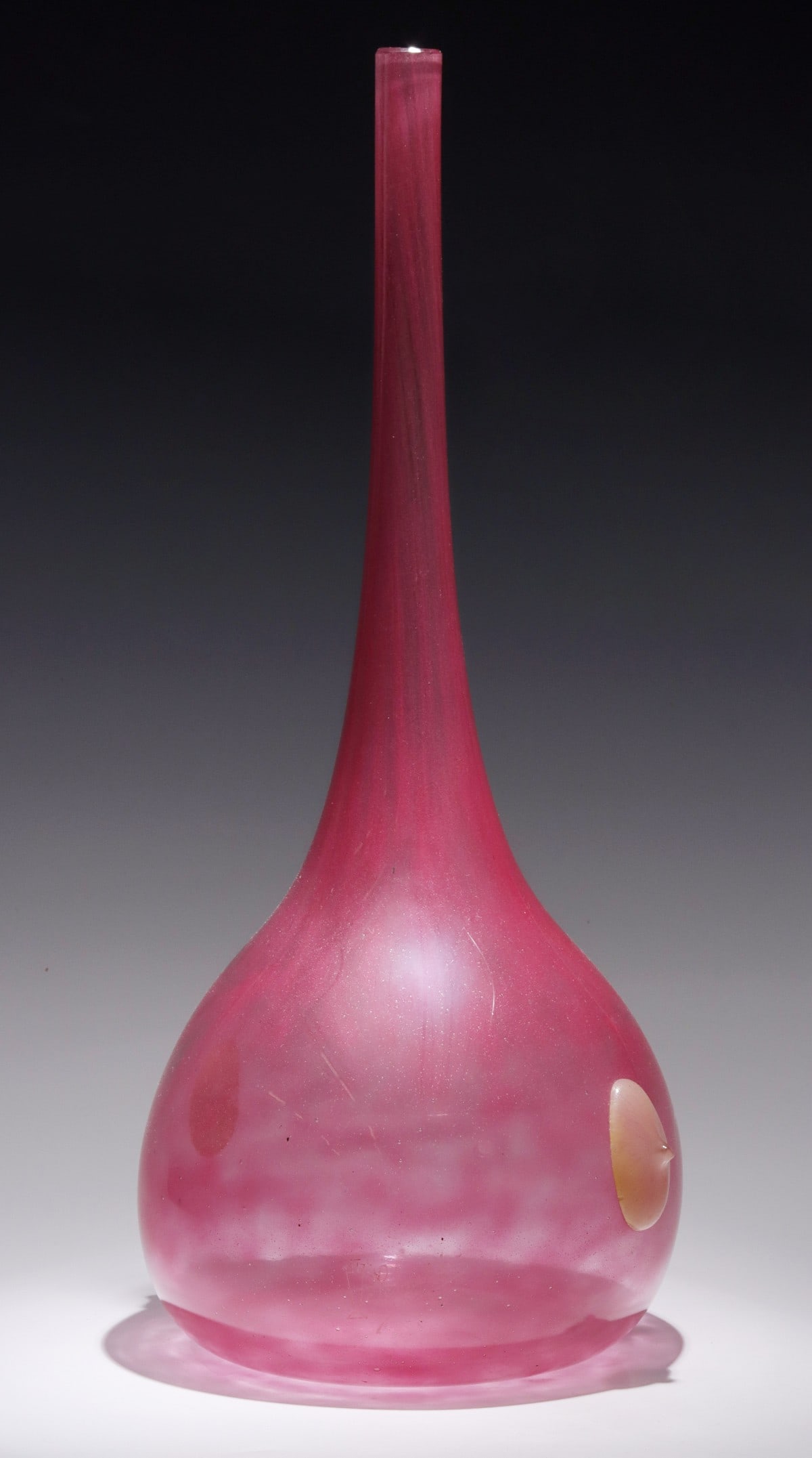 A FRENCH ART GLASS VASE WITH PRUNTS SIGNED SCHNEIDER: The globular form of internally mottled pink glass with applied yellow cabochons is wheel carved Schneider on the base with vase pictograph engraving. Measures 16.25 x 6.25 x 6.25 inches. Without proo