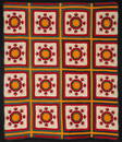 AN 1883 KANSAS QUILT WITH CHILD'S HAND & FAMILY HISTORY