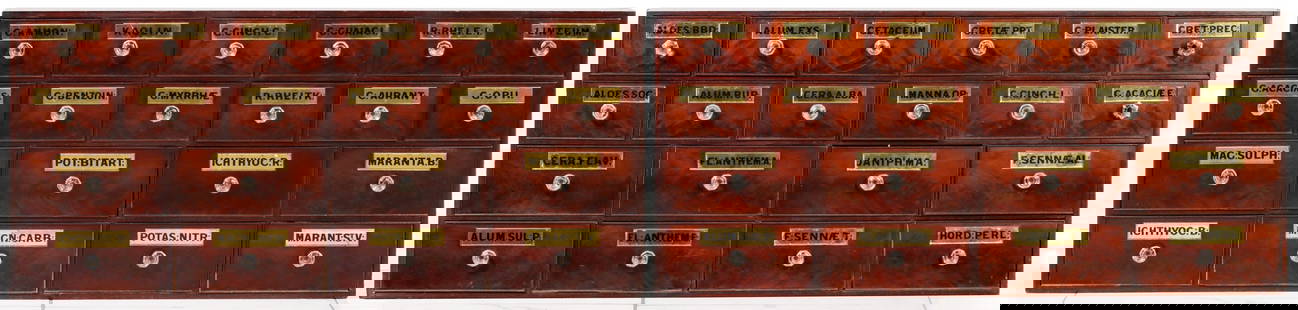 TWO 19C APOTHECARY CABINETS WITH REVERSE PAINTED LABELS: The matching cabinets are each configured with eight large drawers below twelve smaller drawers, all having cock beaded moldings framing the flame mahogany fronts which are set with a thick, gold foil
