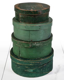 A GROUP OF FOUR 19C AMERICAN PANTRY BOXES IN OLD PAINT: The group in graduated sizes are, except for one, of plain lapped construction with iron tacks. The fourth is constructed with long tapered fingers on the lapping bands. Each retains its original gree