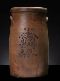 VERY RARE J. E. MERRIMAN SANTA FE ILLINOIS STONEWARE: The salt glazed stoneware churn with stenciled cobalt decoration and an impressed numeral 4 near one lug handle is lettered M F G BY J. E. MERRIMAN above the rough-hewn stenciled depiction of a flower