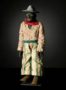 A 19C. BLACK AMERICAN CARVED PAINTED FOLK ART FIGURE: The figure with exceptionally well carved detail, particularly in the execution of the hands, is dressed in gauzy print shirt and striped pants circa late 19th century. The shirt is tacked to the wood