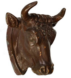 A 19TH CENT MOLDED ZINC STEER HEAD BUTCHER'S TRADE SIGN: The hollow molded figure with layers of brown paint is depicted with a buckled collar. Measures 8 x 9.75 x 8.75 inches. Provenance: Private Collection Denver, Colorado. Without proof of exemption, be