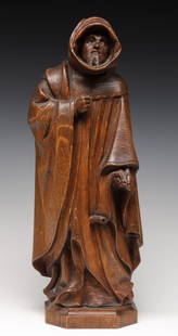 A 19TH CENTURY FRENCH CARVED OAK MONK IN ROBES: The carved figure is patinated to a worm honey color. Measures 18.5 x 7 x 5 inches. Provenance: Private Collection Denver, Colorado. Without proof of exemption, be aware that internet sales tax applie