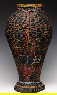 A LARGE 1930s ANAMOSA PENITENTIARY FOLK ART BASKET: During the 1930s, a particular form of Folk Art, sometimes classified as Outsider Art, obviously Prison Art, was created at the Anamosa State Penitentiary in Anamosa Iowa. Purportedly, examples of thi