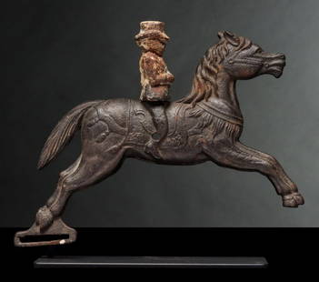 C.W. PARKER DECORATED PONY WITH KNOCKDOWN RIDER TARGET: The cast iron figure of a full stride circus pony with fancy blanket, tasseled crupper and ornamental breast collar is mounted with a rider in top hat hinged at the waist. A successful shot would knoc