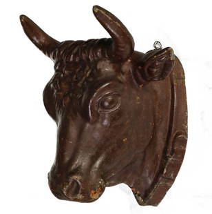 A 19TH CENT MOLDED ZINC STEER HEAD BUTCHER'S TRADE SIGN: The hollow molded figure with layers of brown paint is depicted with a buckled collar, Measures 7.75 x 9.75 x 8.75 inches. Provenance: Private Collection Denver, Colorado. Without proof of exemption,