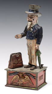 A SHEPHARD HARDWARE UNCLE SAM FIGURAL MECHANICAL BANK: The good, period cast iron example is found in original untouched paint with its closure and patent date of 1886 cast in the base. Measures 11.5 x 5 x 4 inches. Provenance: Private Collection Denver,