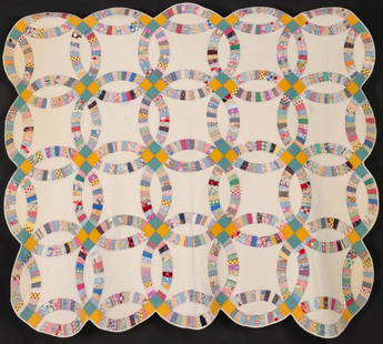 A DOUBLE WEDDING RING QUILT IN FEEDSACK FABRICS: The twin-sized Double Wedding ring pattern quilt with feed sack fabrics, muslin background, scalloped edges, nicely hand-quilted. muslin backing. Measures 78 x 64 inches. Without proof of exemption, b