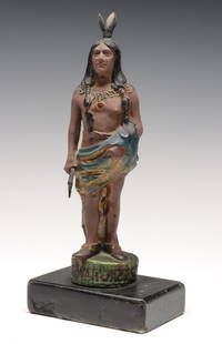 A FIGURAL DO-WAH-JACK INDIAN FIGURAL STOVE FINIAL: The top finial from a Round Oak Stove is mounted on later base and in old re-paint. Measures 11 x 5 x 3.5 inches. Provenance: Private Collection Denver, Colorado. Without proof of exemption, be aware