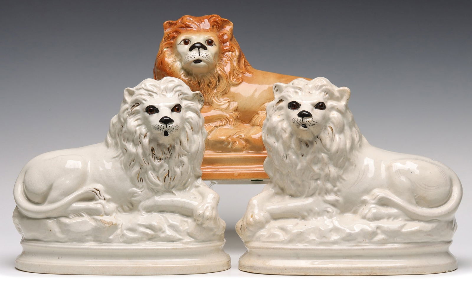 THREE 19TH CENTURY STAFFORDSHIRE POTTERY LIONS (1 of 20)