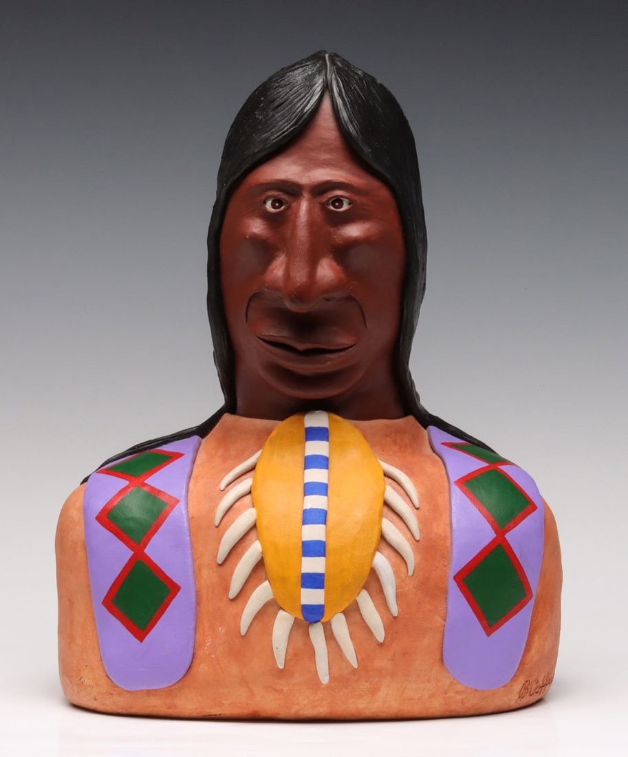 BARRY COFFIN (KANSAS 1947-2016) MIXED MEDIA SCULPTURE: Barry Coffin (Kansas Native American 1947-2016) The classic Barry Coffin sculpture in bright colorful glazes depicts a Native American brave with pronounced features and breastplate encircled with ani