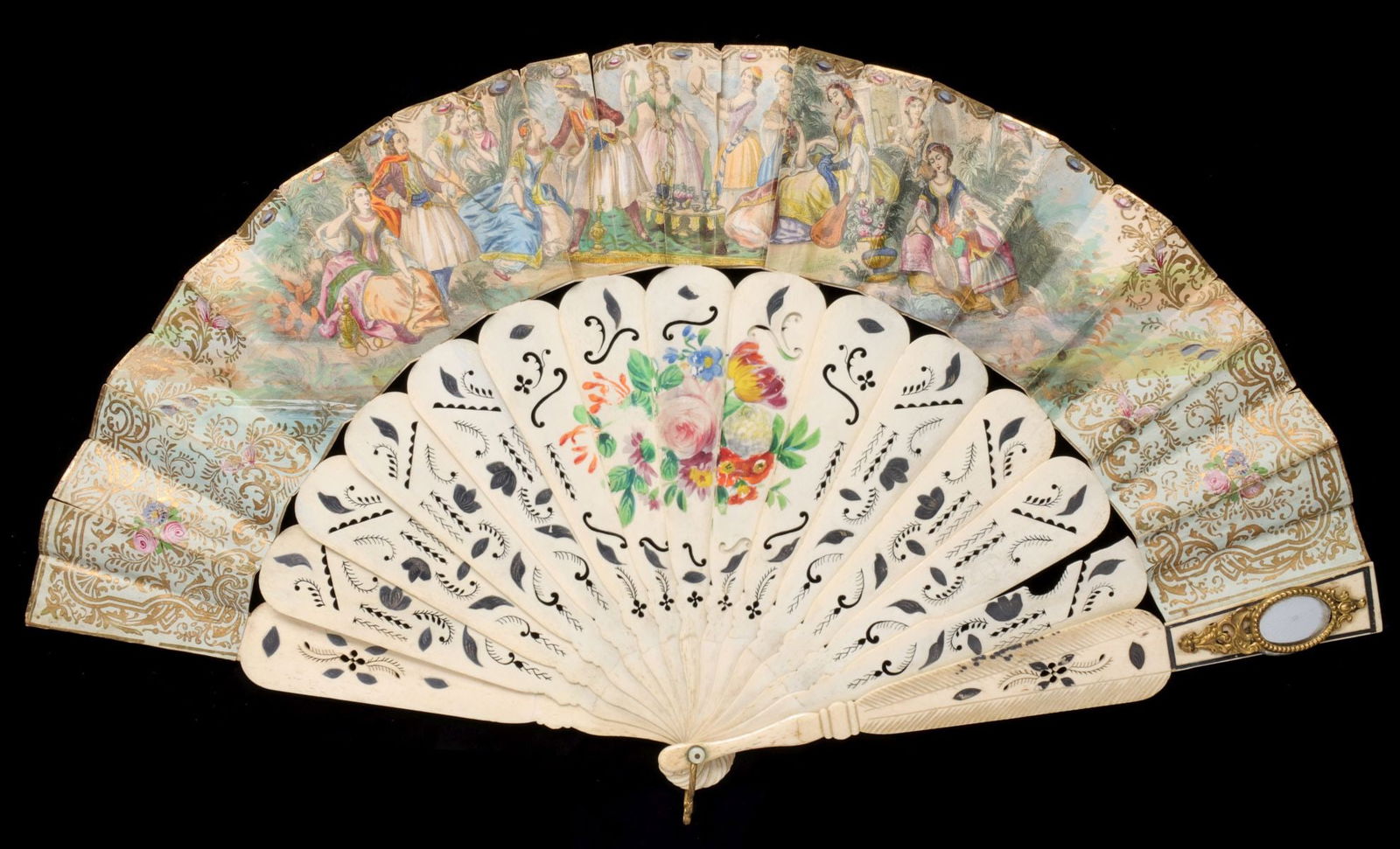 AN ELABORATE 19TH CENTURY HAND FAN WITH MIRROR: The carved and painted bone sticks are mounted with hand colored stone litho papers and an unusual mirror in ormolu bezel on one end. Measures 11.25 x 20 inches. Without proof of exemption, be aware t