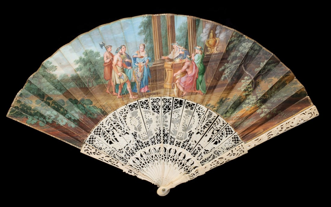 A 19TH CENTURY FAN WITH HAND PAINTED IMAGE OF EUROPA: The pleated leaf is painted fully by hand with Classical figures depicting the story from Greek mythology of how Zeus abducted Europa, a Phoenician princess, by turning himself into a white bull. The 