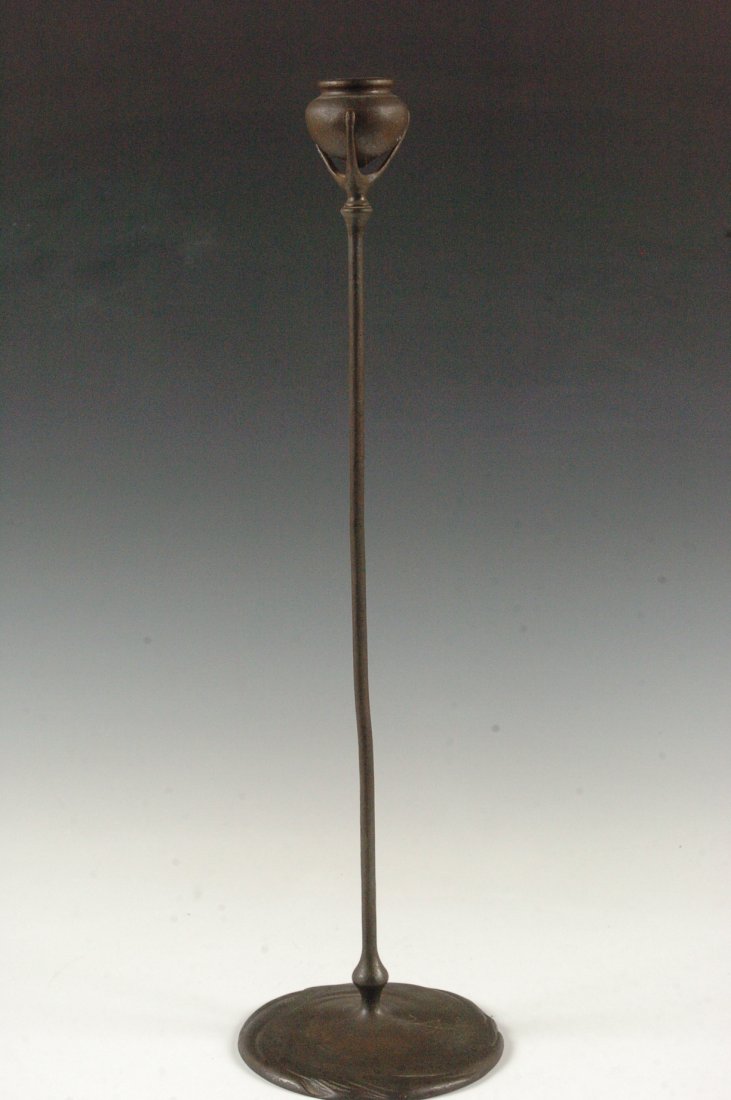 BRONZE TIFFANY STUDIOS TENDRIL CANDLESTICK #1213: Patinated bronze candlestick with stamped signature of Tiffany Studios New York number 1213 , measures 20.5 inches.