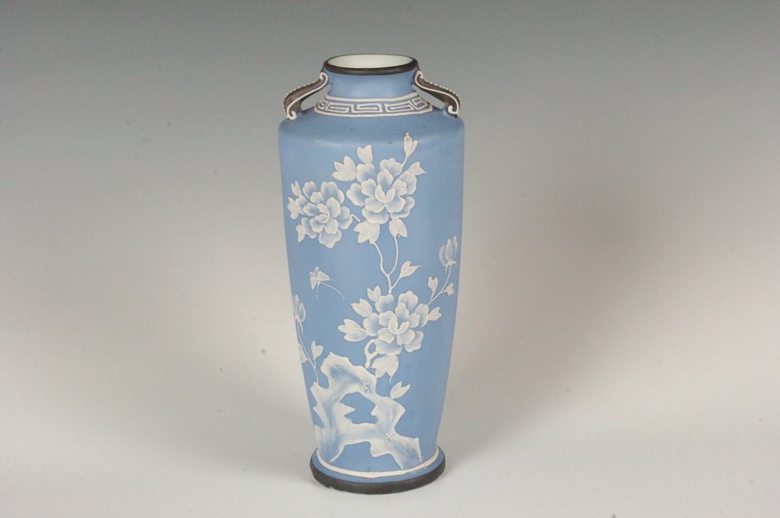UNUSUAL NIPPON ERA VASE WITH MORIAGE JASPER EFFECT: An unusual vase with blue bisque ground and white MORIAGE enamels that achieve together a jasper ware effect similar to that of Wedgwood.. Measures 9 x 4 inches. Has a green over glaze Japanese makers