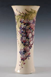 RARE 16.75 INCH 'PLUM WISTERIA' MOORCROFT POTTERY VASE: Signed with under glaze green mark and stamped monogram for McIntyre Burslem. Measurements of 16.75 x 7 inches.