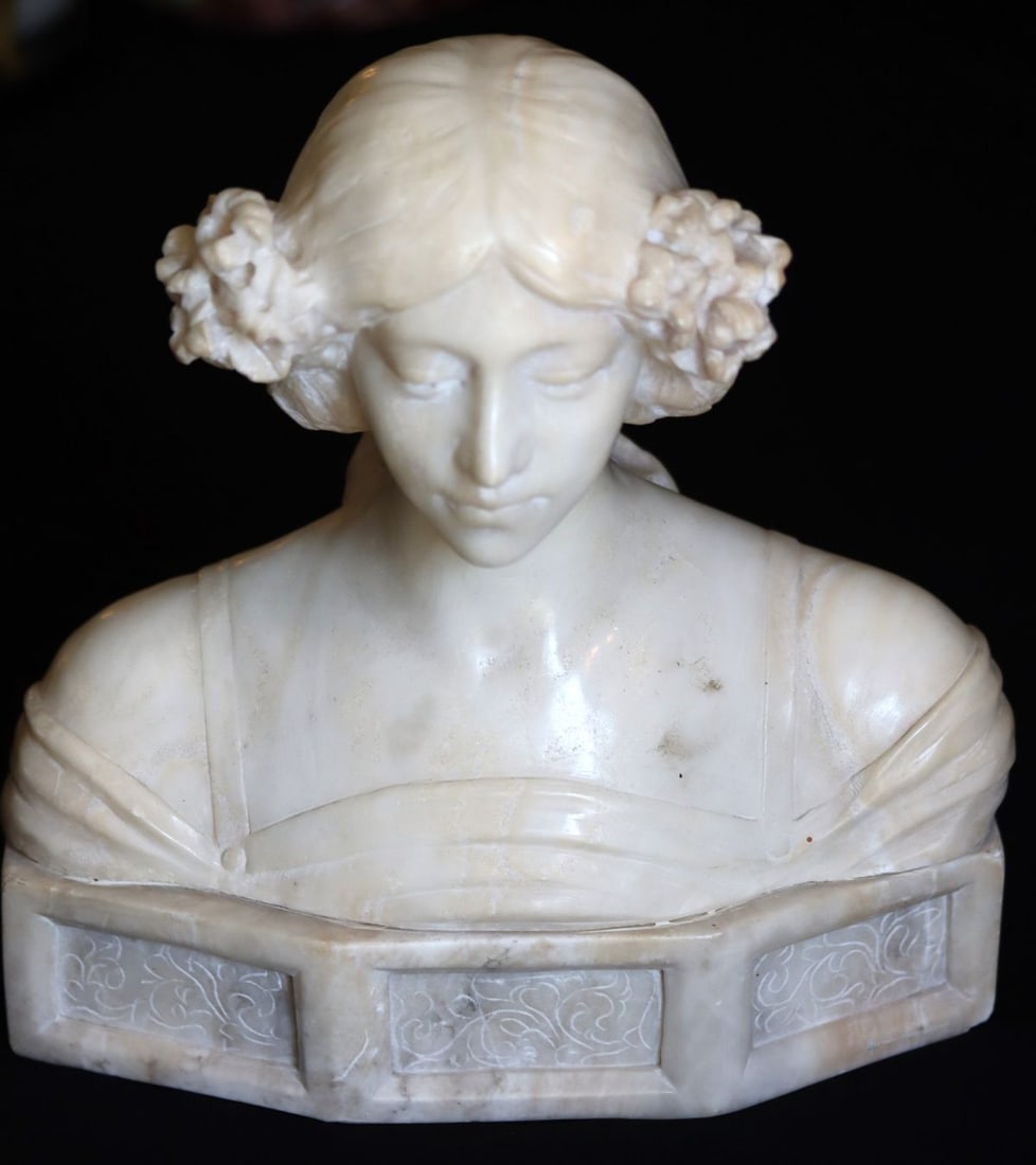 A LATE 19C. ITALIAN MARBLE AND ALABASTER BUST: The sculpted marble bust of a young maiden is mounted on a carved alabaster plinth. No signature found. Measures 11 x 10.75 x 5 inches. Without proof of exemption, be aware that internet sales tax app