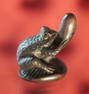 A CARVED AND INLAID BOXWOOD NETSUKE