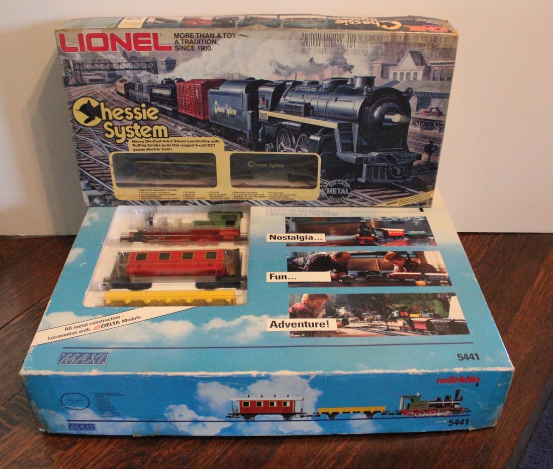 MARKLIN AND LIONEL TOY TRAIN SETS IN ORIG. BOXES: 1) Marklin Maxi 5441 Shourt Line G scale train set, all metal chassis, Marklin Maxi Steam Loco with smoke and lights, low gondola and passenger cars, controller, oval track and engineer and fireman fi
