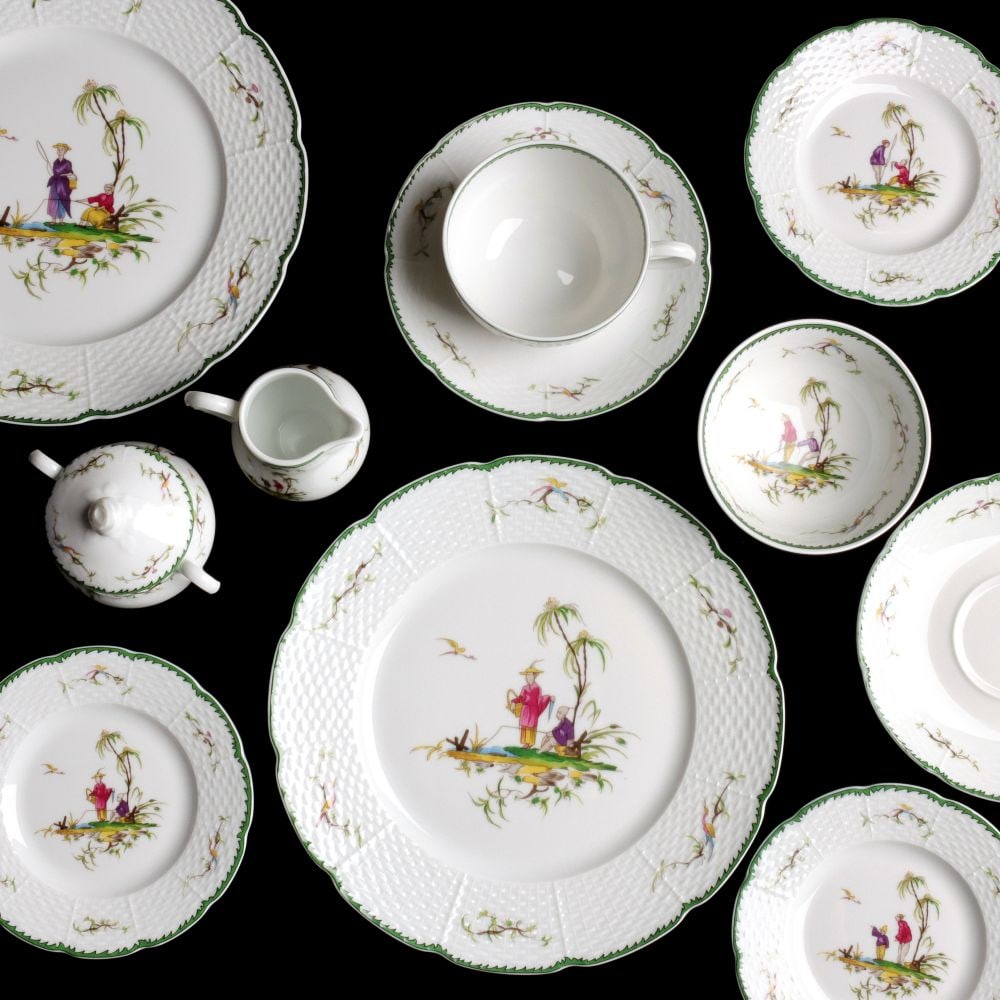 TWELVE PLACE SETTINGS OF RAYNAUD SI KIANG PORCELAIN: The set of Si Kiang pattern No. 6 porcelain dinnerware by Raynaud is offered in excellent condition as shown. Twelve 10.75 inch dinner plates, twelve 6.5 inch saucers, twelve 7 inch saucers, twelve 2.