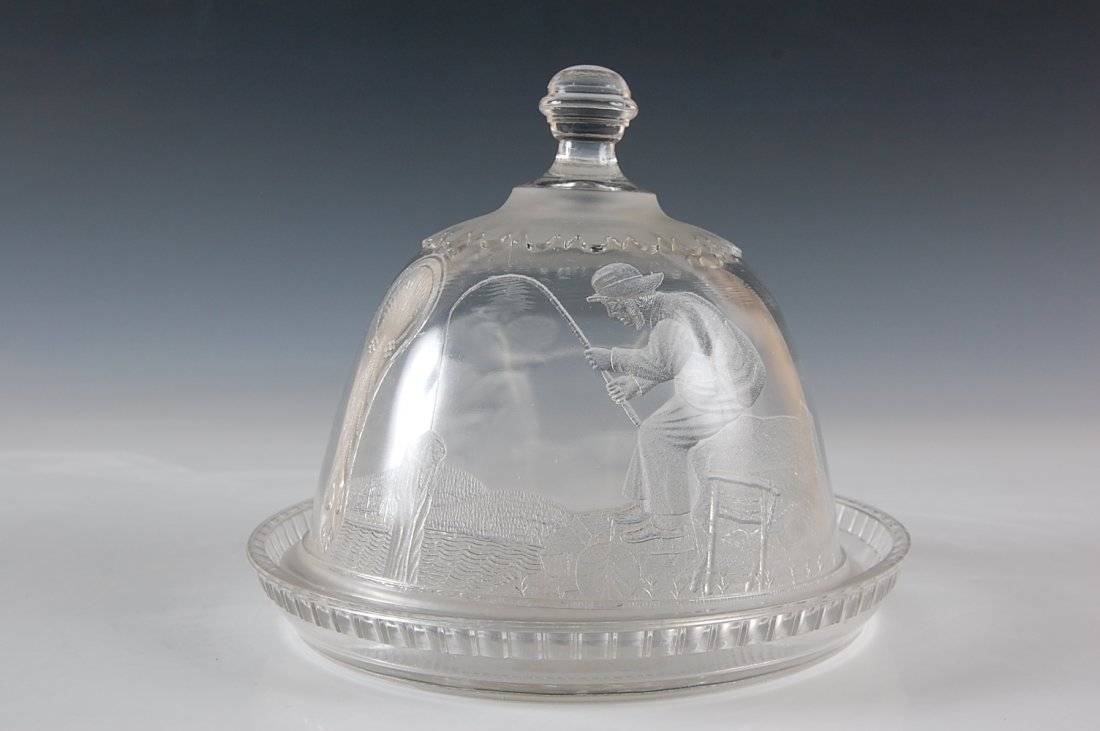 ACTRESS PATTERN EAPG CHEESE DISH BOY FISHING DROMIOS: Domed lone fisherman cheese dish With Two Dromios base. Measures 7 x 8 inches.