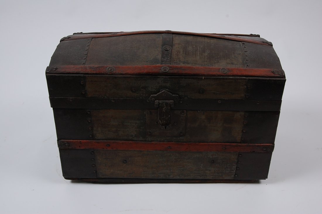 CIRCA 1875 CHILD'S SIZE CAMEL BACK TRUNK: With chromlithograph print inside the lid, no inside till, Measures 12.5 x 18 x 10 inches.