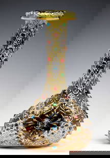 A JEWELED MOSER VASE WITH ROLLED RIM AND MUGHAL DESIGNS: The bottle-form vase is shaded from a rose tint base to green at the rolled top rim and decorated in Mughal influence medallions of raised enamels embellished by more than 50 applied glass jewel-like