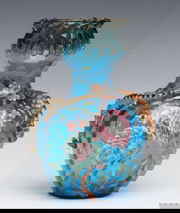 A LARGE BLUE MOSER ART GLASS URN WITH ENAMELED LIZARDS: Ludwig Moser Late 19th Century The urn blown in an attractive shade of blue crystal is embellished with a thick lava-like application of amber glass at the rim above a waisted neck blending to the