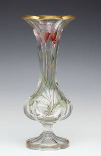 A MOSER QUALITY INTAGLIO CARVED VASE WITH ENAMEL COLOR: The six-sided vase of baluster form is raised on a petal form foot and embellished with intaglio carving of poppies subtly decorated in polychrome enamels. Measures 15.75 x 6 inches. Without proof