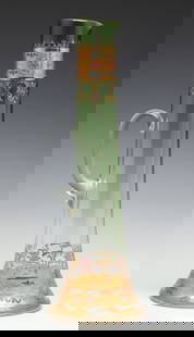 AN 18-INCH MOSER GILT AND ENAMEL DECORATED GLASS EWER: The tall crystal ewer shaded green to colorless glass is decorated in polychrome enamels and gilding, with an applied handle. The base is stamped with the Moser Glasfabrik MM Karlsbad Austria mark