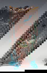 VASE WITH AQUATIC THEMES IN VARIOUS TECHNIQUES: The Moser/ Bohemian shaded smoky amethyst glass vase of squarish form is embellished with seaweed glass applications and freeform feet in light blue, all decorated in tiny white enamel flowers. The