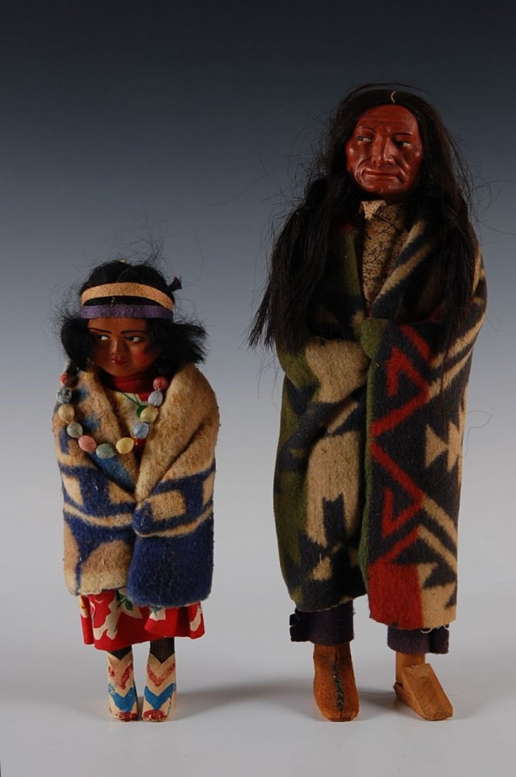 TWO SKOOKUMS INDIAN DOLLS CIRCA 1930S: Measure 13 inches and 9.5 inches respectively.