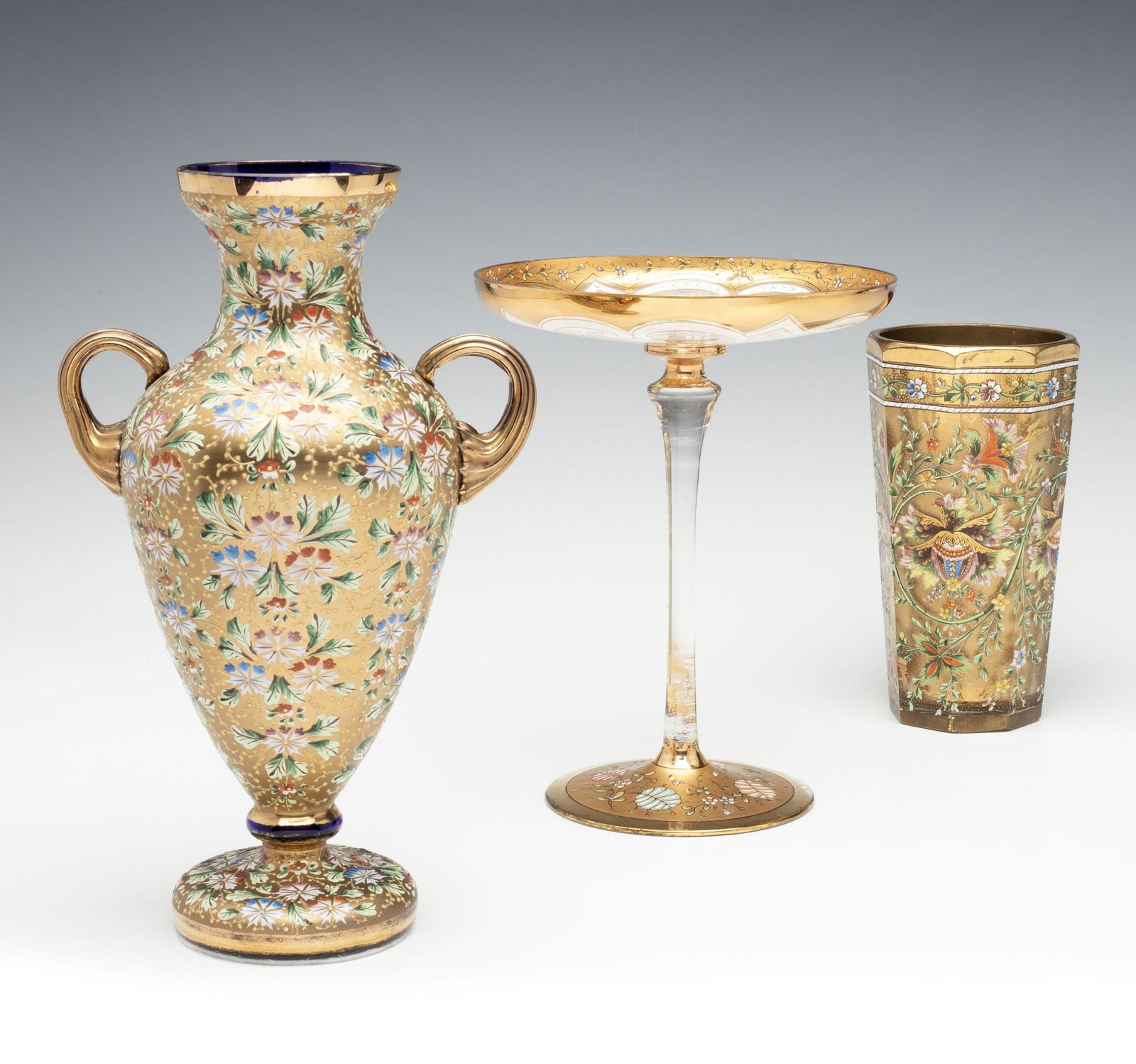 MOSER AND OTHER GILT AND ENAMEL DECORATED ART GLASS: Ludwig Moser Early 20th Century Three nice pieces offered together as shown. Sizes range from 6.25 to 9.75 inches. Without proof of exemption, be aware that internet sales tax applies to all Internet