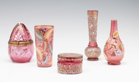 FOUR EXAMPLES OF MOSER CRANBERRY ART GLASS WITH ENAMEL