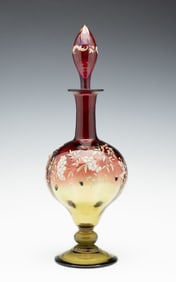 AN INTENSELY COLORED MOSER QUALITY BOTTLE WITH ACORNS