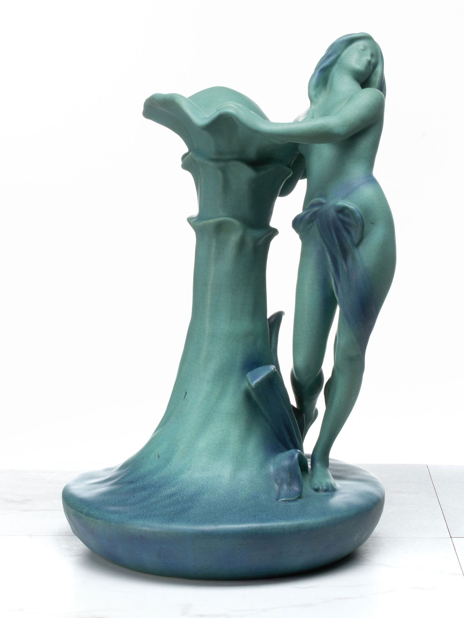 A RARE AND UNIQUE ART POTTERY VASE ATTR VAN BRIGGLE: Circa 1920s An unsigned Art Nouveau influence pottery vase with figural nude displaying the glaze, styling, and clay body attributes of art pottery made by the Van Briggle Pottery company of Colorado