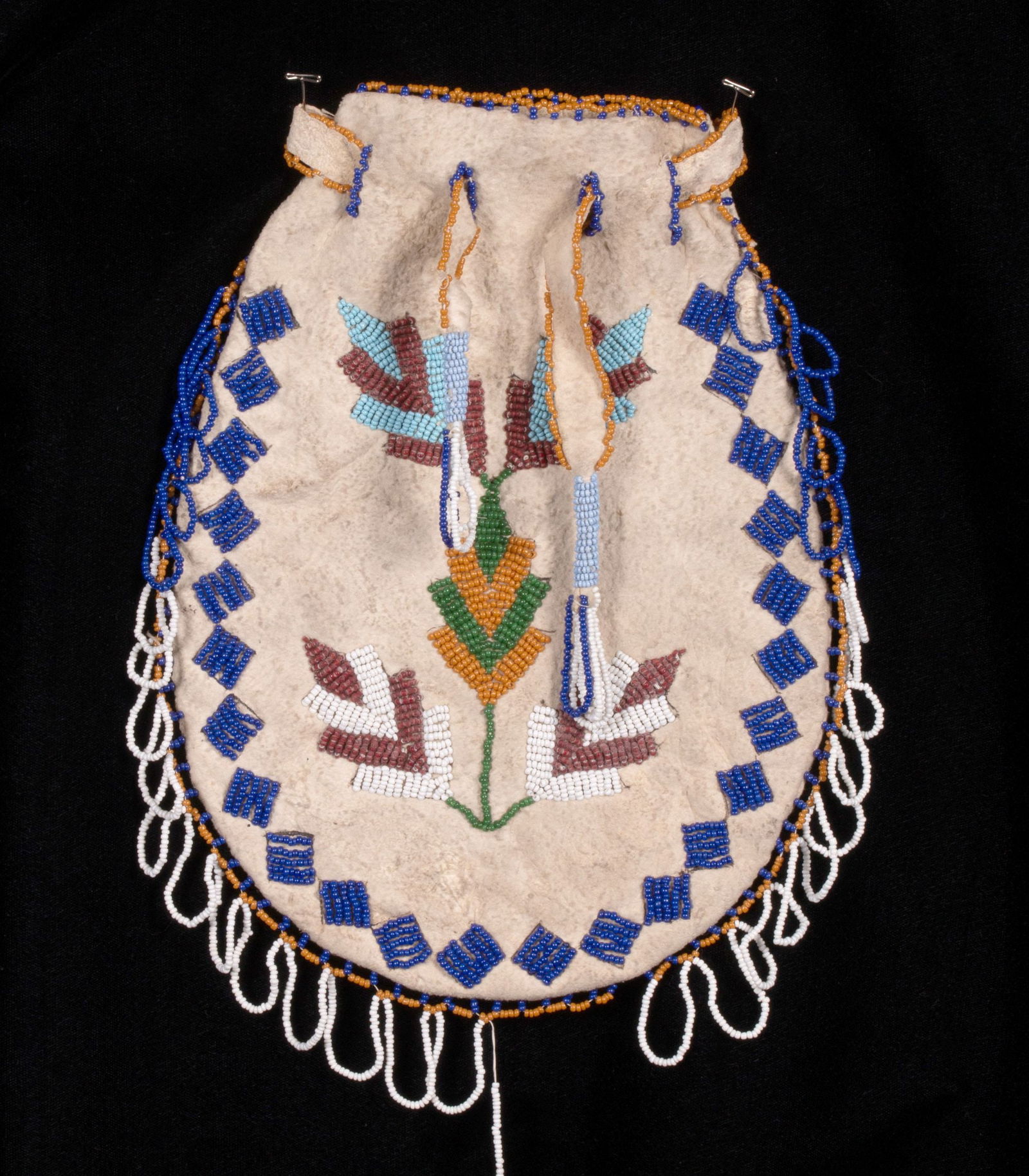 AN EARLY 20TH CENTURY NORTHERN PLAINS BEADED BAG (1 of 9)