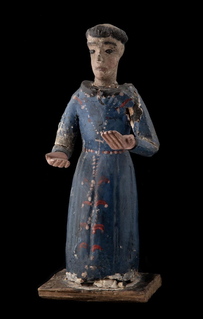 AN 18TH CENTURY CARVED AND GESSOED WOOD SANTO: The unidentified santo with blue robe and clerical tonsure is offered as shown. Measures 9.5 x 4 x 4.25 inches. Without proof of exemption, be aware that internet sales tax applies to all Internet tra