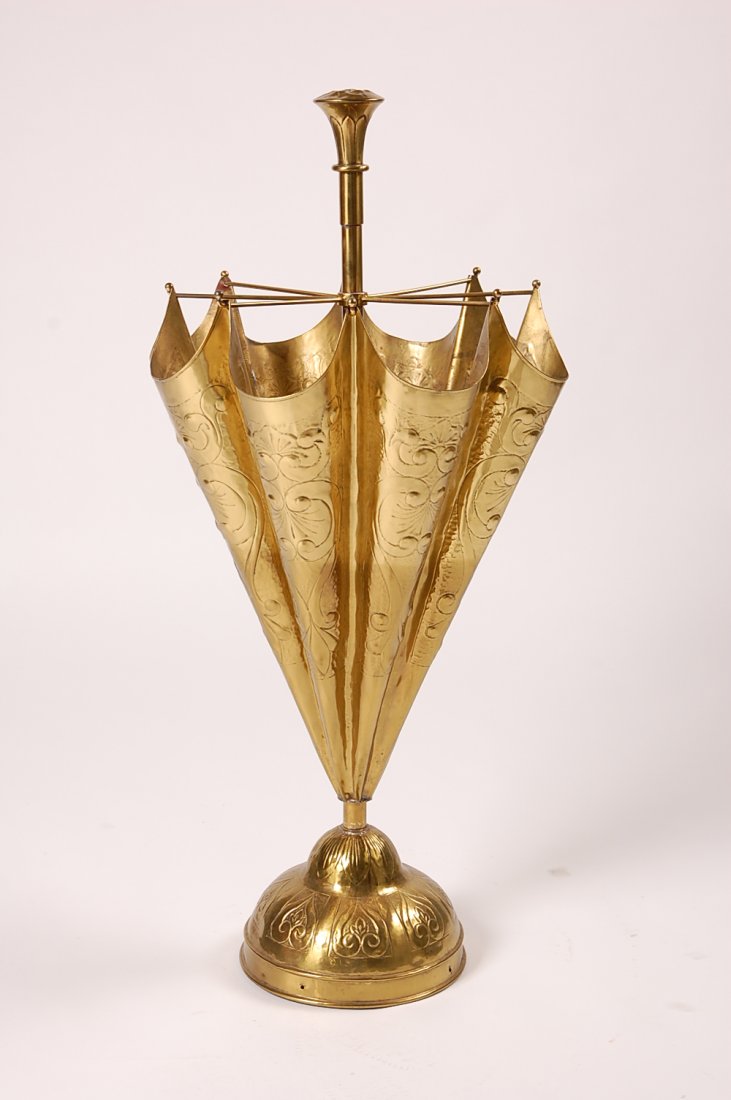 AN UNUSUAL CHASED BRASS UMBRELLA FORM STAND: Measures 37.5 x 18 inches.