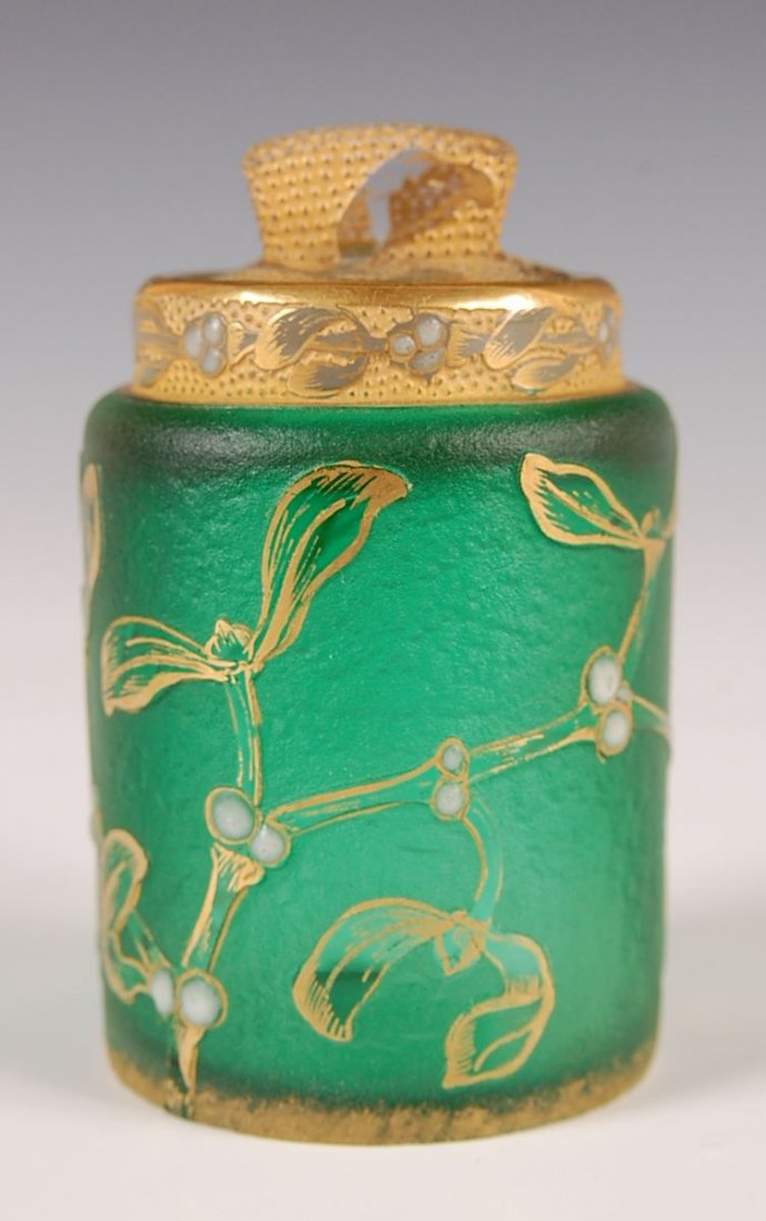 DAUM 'MISTLETOE' CAMEO GLASS BOTTLE WITH ENAMEL HI: A miniature perfume decorated with Mistletoe leaves, vines and white enamel berries trimmed in gold against a green textured ground. Signed Daum with Cross of Lorraine and Nancy on the polished base i