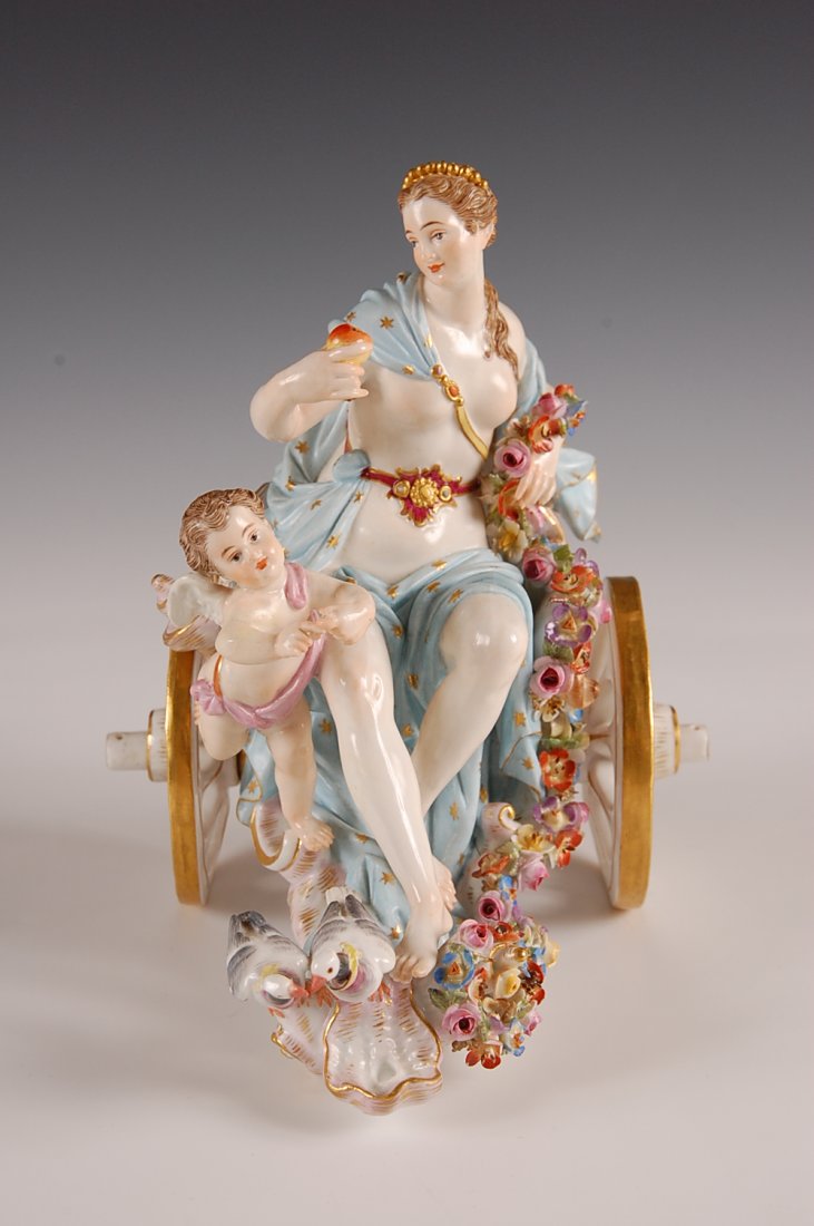 MEISSEN PORCELAIN VENUS AND CUPID IN SHELL CHARIOT: Porcelain sculpture of Venus seated in shell chariot and Cupid with two doves. Meissen blue underglaze crossed swords mark with scratched model number of 2260. Circa mid 19th century. Losses and repai