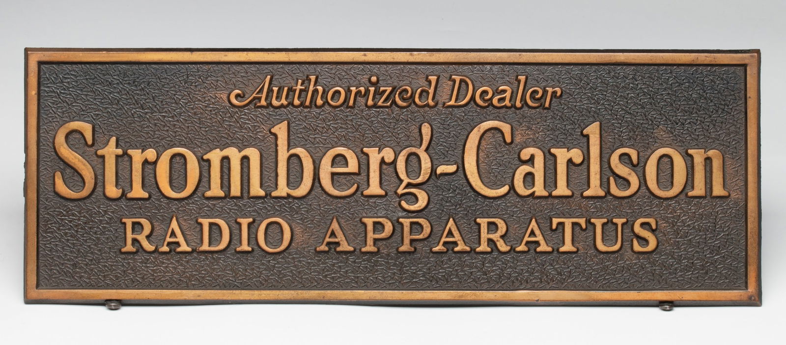 A STROMBERG-CARLSON RADIO APPARATUS BRONZE SIGN (1 of 6)