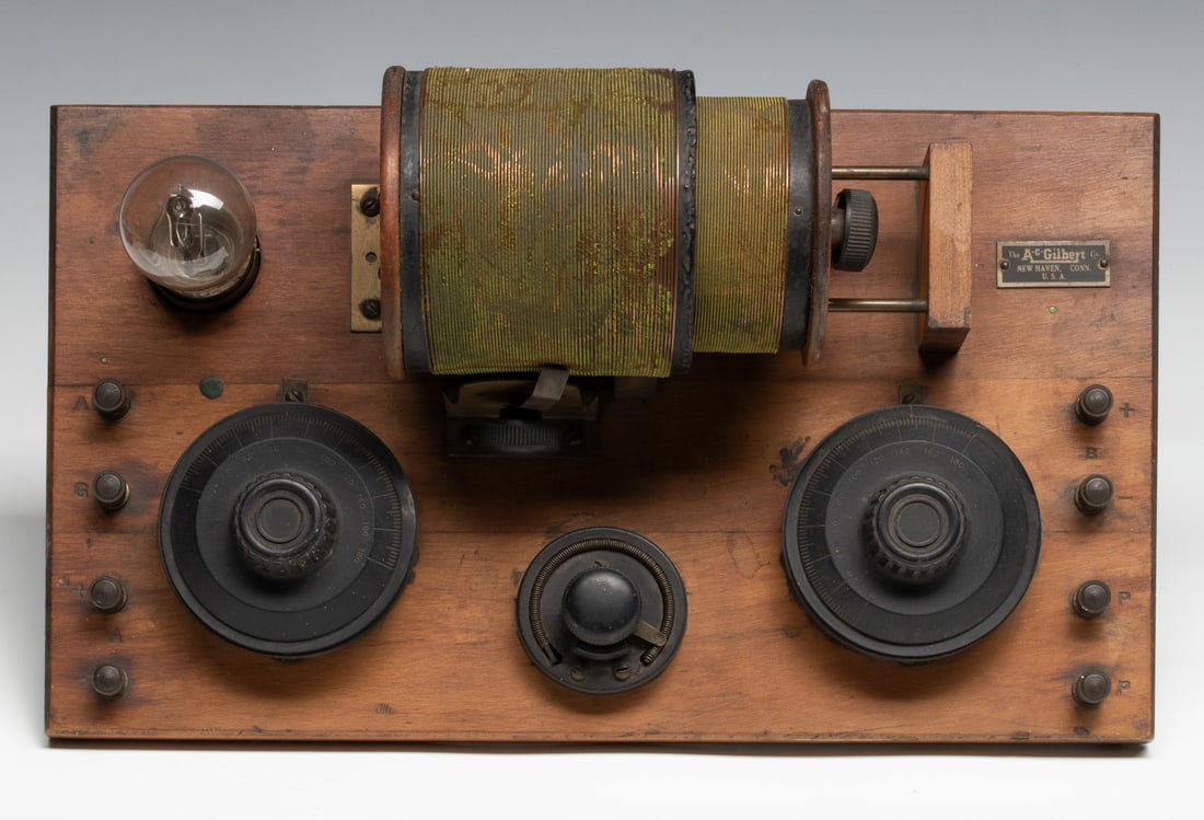 RARE EARLY ONE-TUBE BREADBOARD RECEIVER BY A.C. GILBERT: The A.C. Gilbert Co., 1-Tube Breadboard Receiver #4018 is circa 1922. The operating condition is not known. Base measures 14.75 inches long. Without proof of exemption, be aware that internet sales ta