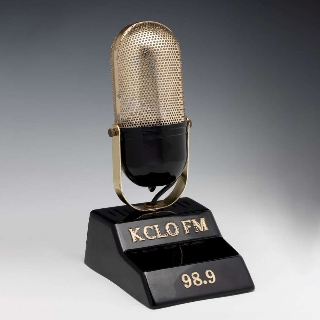 A VINTAGE SINGLE STATION RADIO FOR KCLO FEM 98.9: The plastic one-station radio, sans tuning knob, receives only one radio station. The operating condition is unknown. Measures 11 inches tall. Without proof of exemption, be aware that internet sales 