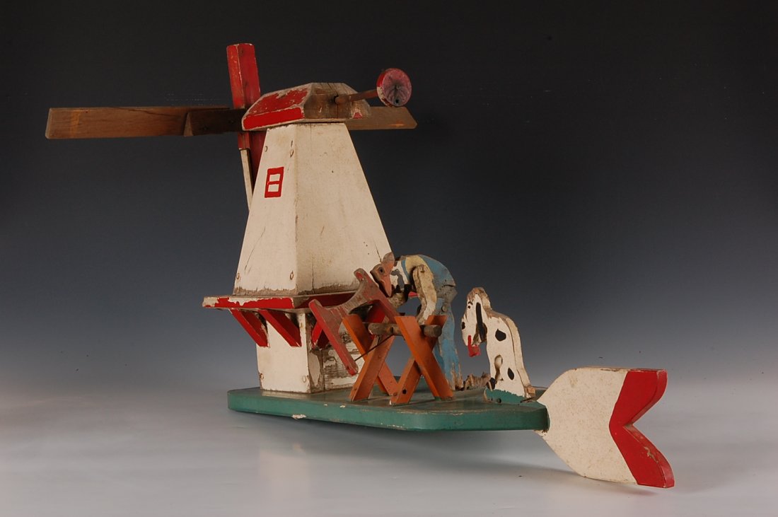 FOLK ART WHIRLIGIG WITH WINDMILL: Measures 15 x 24 inches.