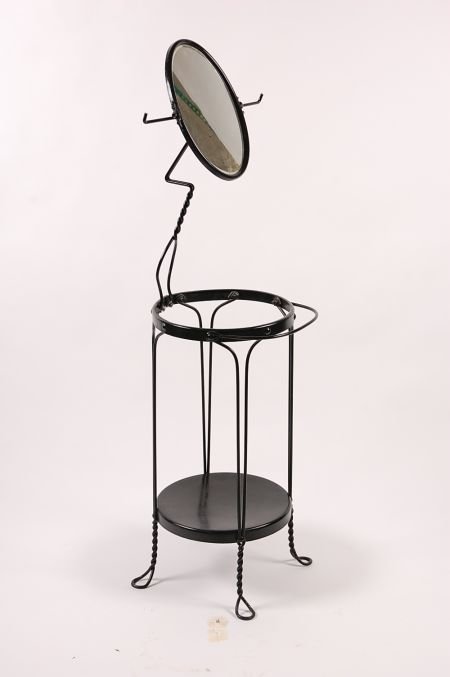 TWISTED IRON VANITY STAND WITH MIRROR CIRCA 1920'S: Holds a wash basin up top and water pitcher below, towel racks on either side of the mirror. Original old beveled mirror with some toning. Measures 57 inches.